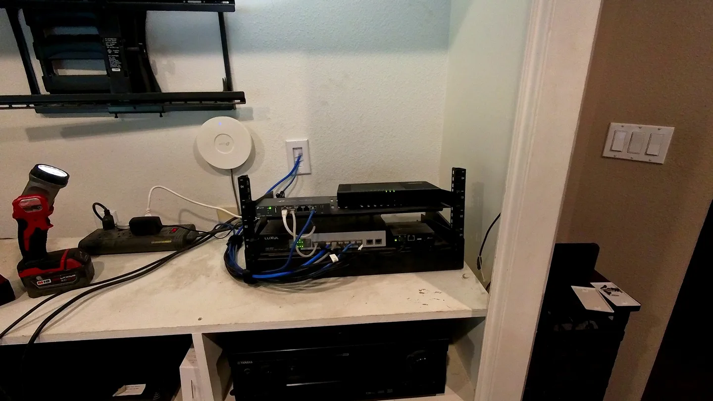 Network rack after cable organization and installation of a wall faceplate